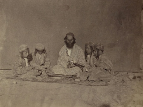 Zaravshanskii okrug. Urok chistopisaniia (Zaravshan okrug. Hand-writing lessons; between 1865 and 1872): Photograph shows a Jewish man surrounded by four young boys. Sergei Mikhailovich Prokudin - Gorskii Collection (Library of Congress, Washington, D.C. 20540 USA).