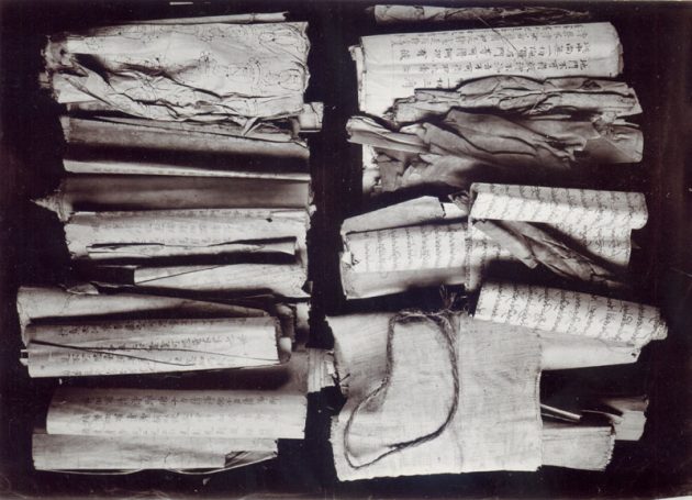 Caves of the Thousand Buddhas (Cat. Stein LHAS Photo 13.1.58)
Dunhuang manuscripts, partially unwrapped.